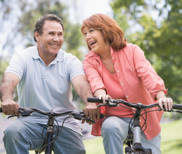 mature couple riding bikes